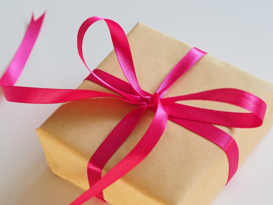 Gift wrapped with a pink ribbon